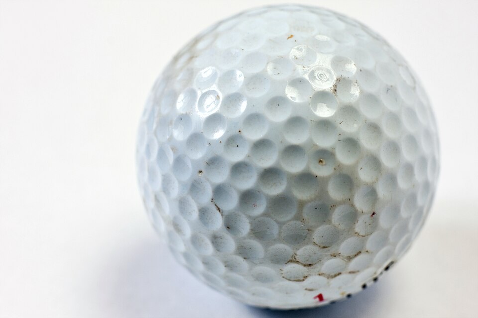 Close-up of the dimples on a golf ball