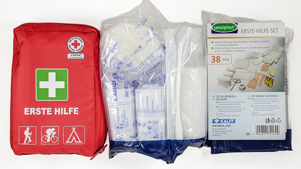 A first aid kit with bandages and dressings